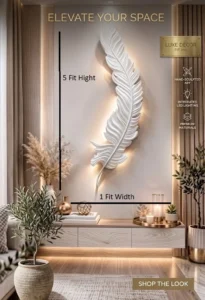 White Shayan Fiberglass large 3D feather wall sculpture with warm integrated LED backlighting mounted on a neutral interior feature wall